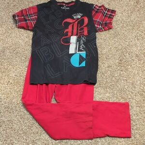 Black and Red Graphic T-Shirt with Red Pants